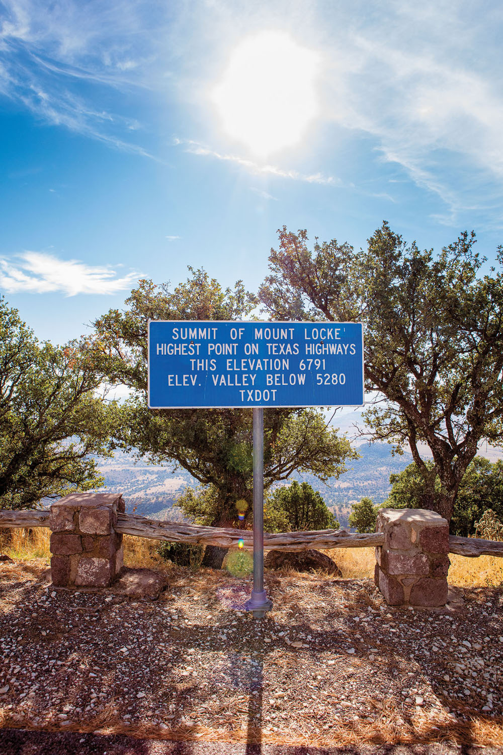 A picture of a sign reading "Summit of Mount Locke. Highest point on Texas Highways. This elevation 6791, elev. valley below 5280. TxDOT."