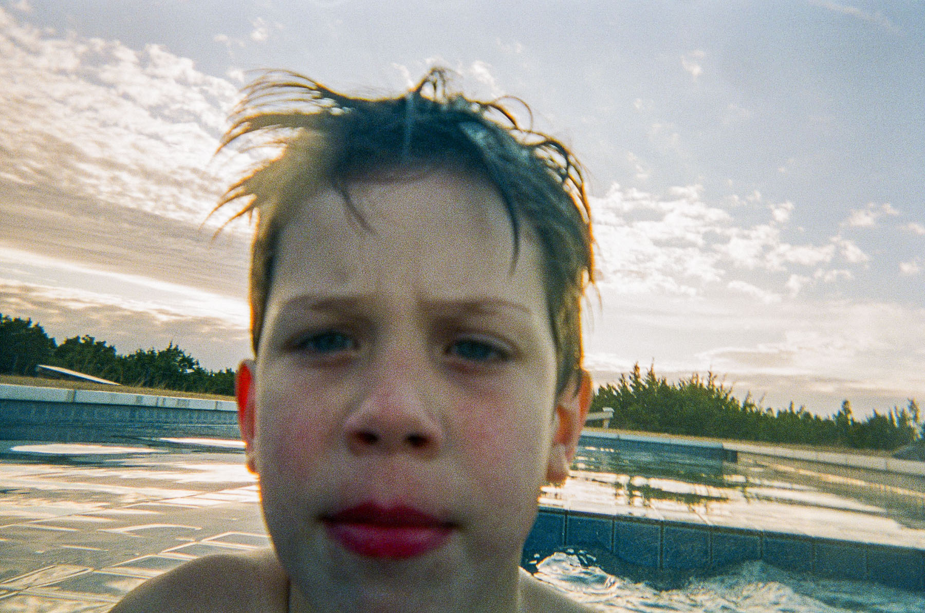 A selfie of a young man in a swimming pool