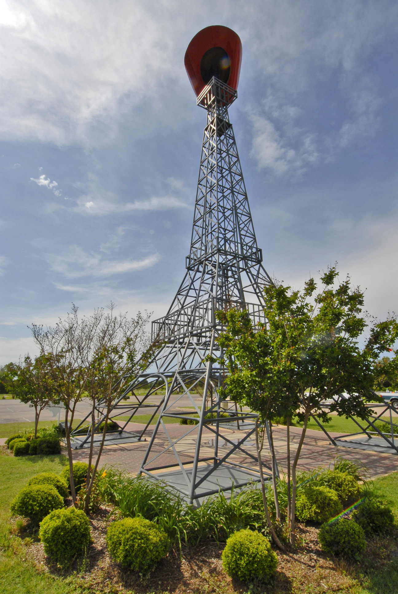 A replica of the Eiffel Tower with a red cowboy hat on top in Paris, Texas