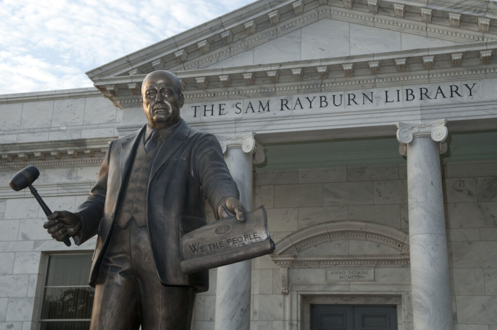 A statue of Sam Rayburn sits outside of the library.