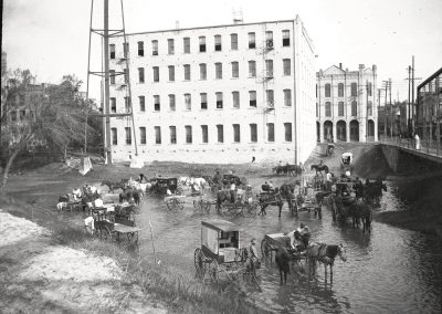 Rinsing Wagons in the San Antonio River
