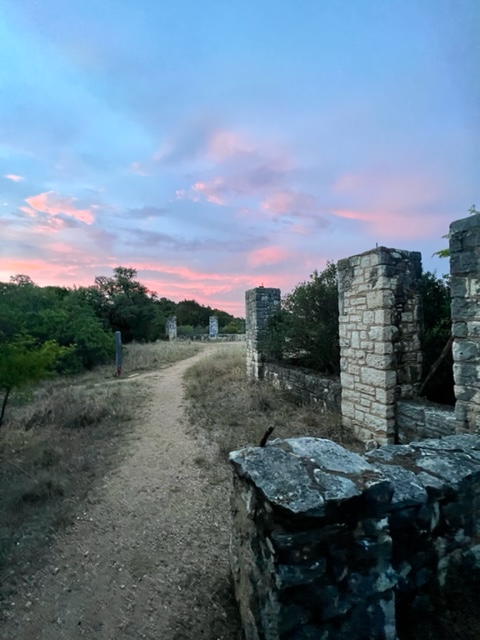 sunset above a trail of limestone pylons