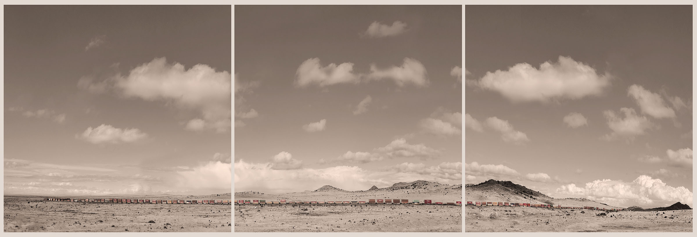 Three images forming a panorama of a freight train moving across the Marfa plateau under a sky with a few clouds