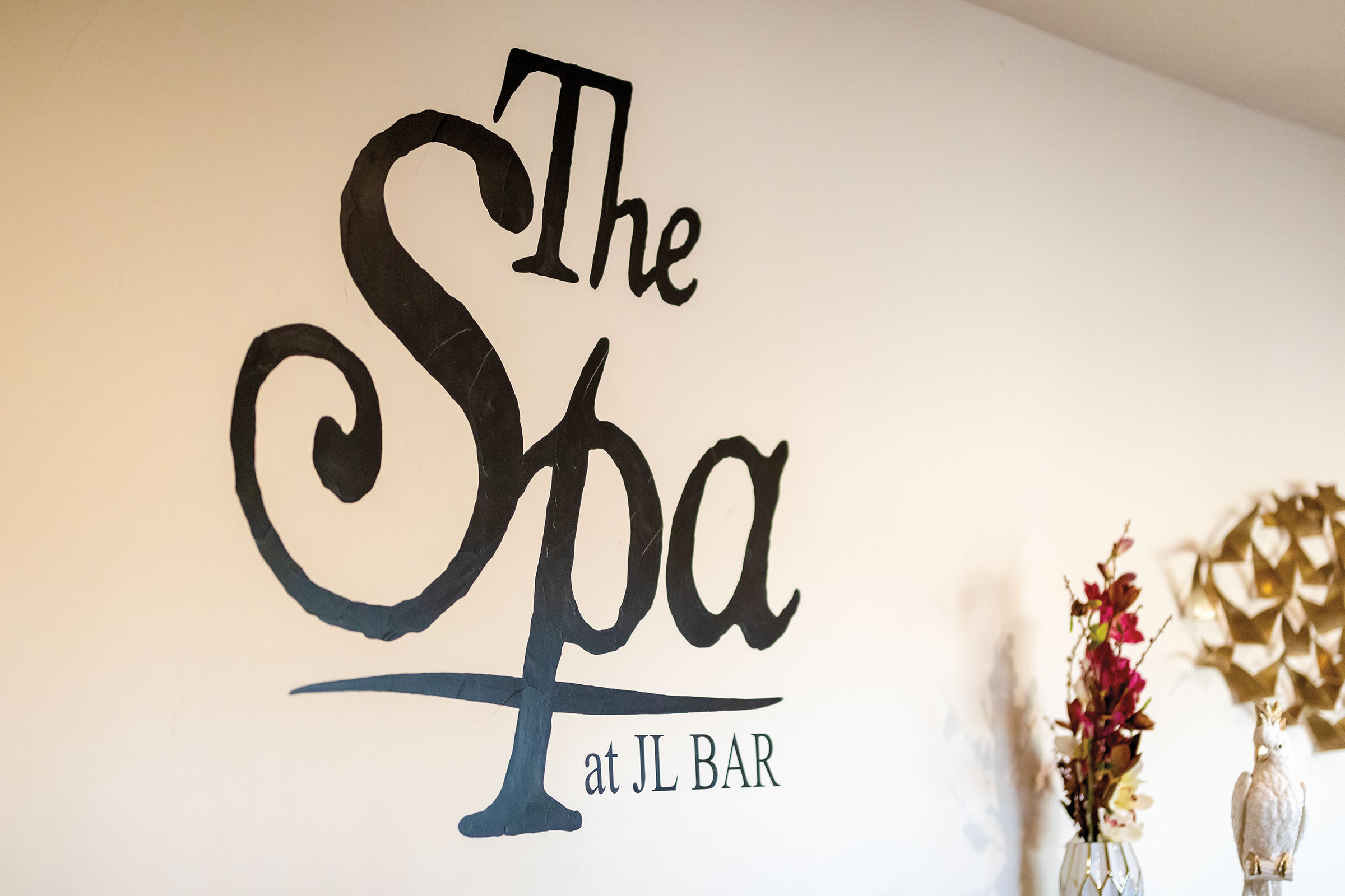 A sign reading "The Spa at JL Bar"