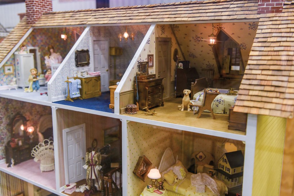 A look inside miniature rooms ornately decorated with small furniture, paintings and more