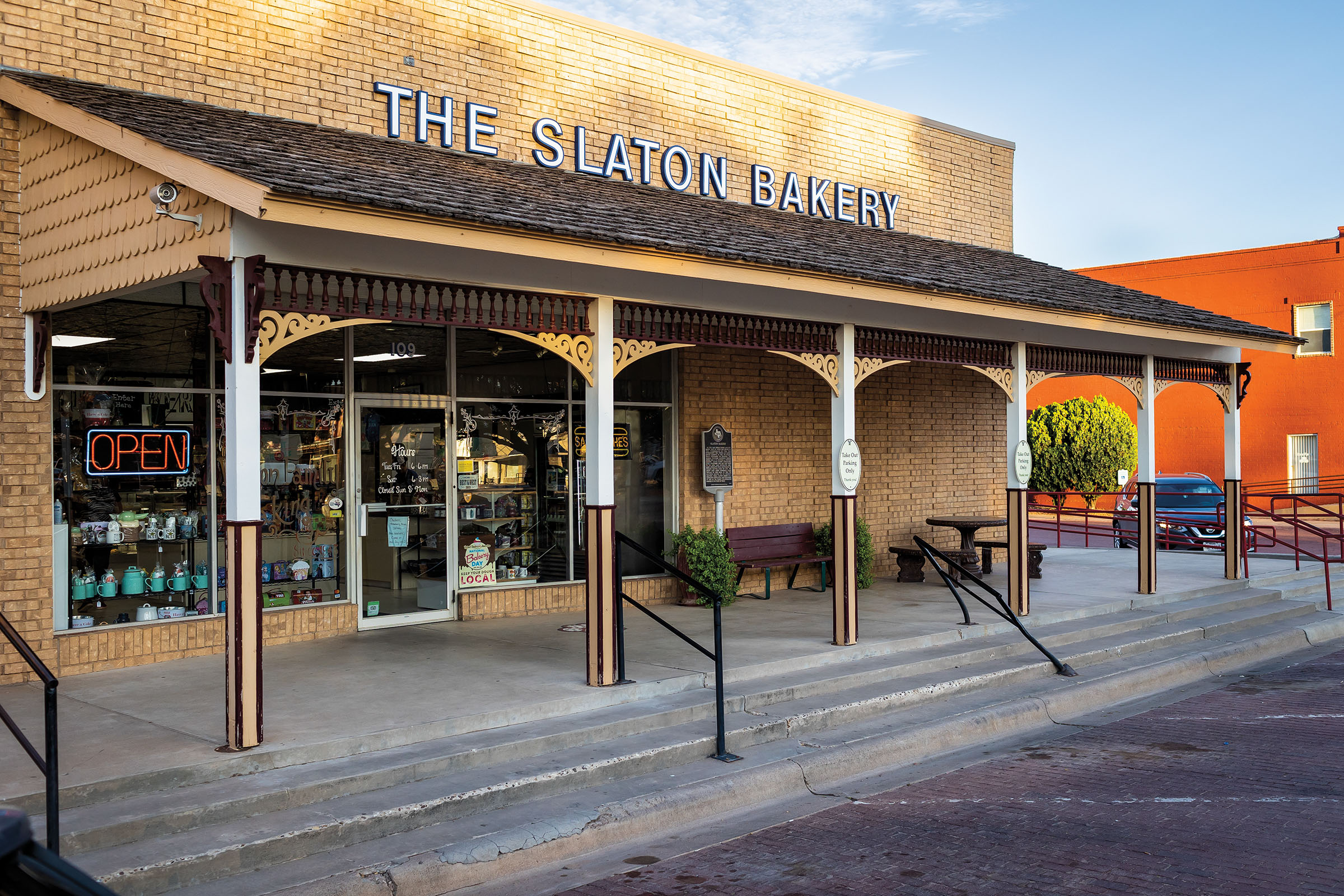 The brick exterior of a building with a sign reading "Slaton Bakery"