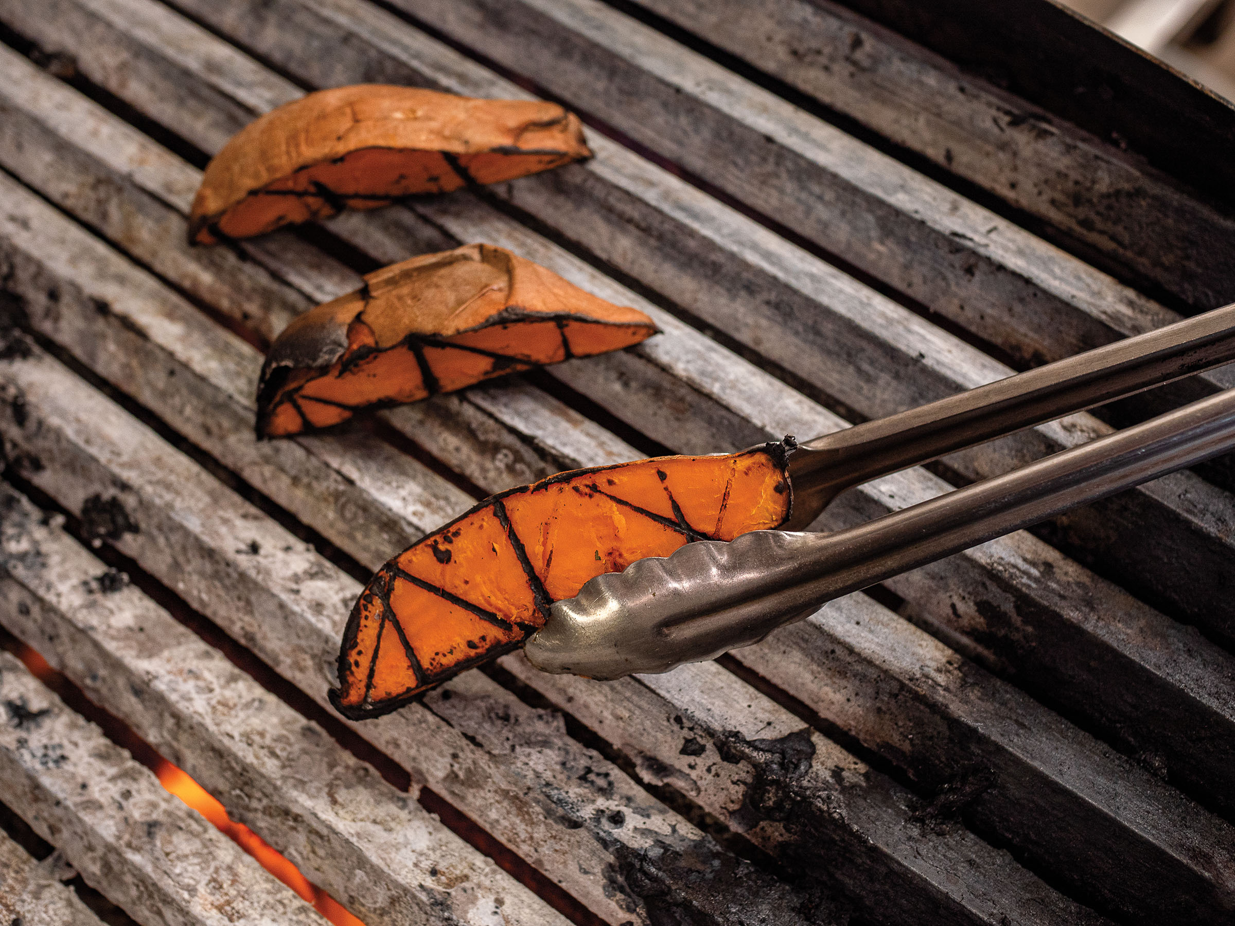 Grilled sweet potato with dark char marks