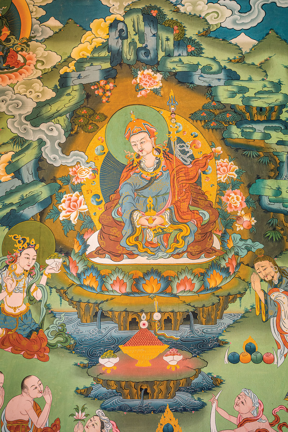 An ornately painted picture of several figures with water, flowers, and green grasses