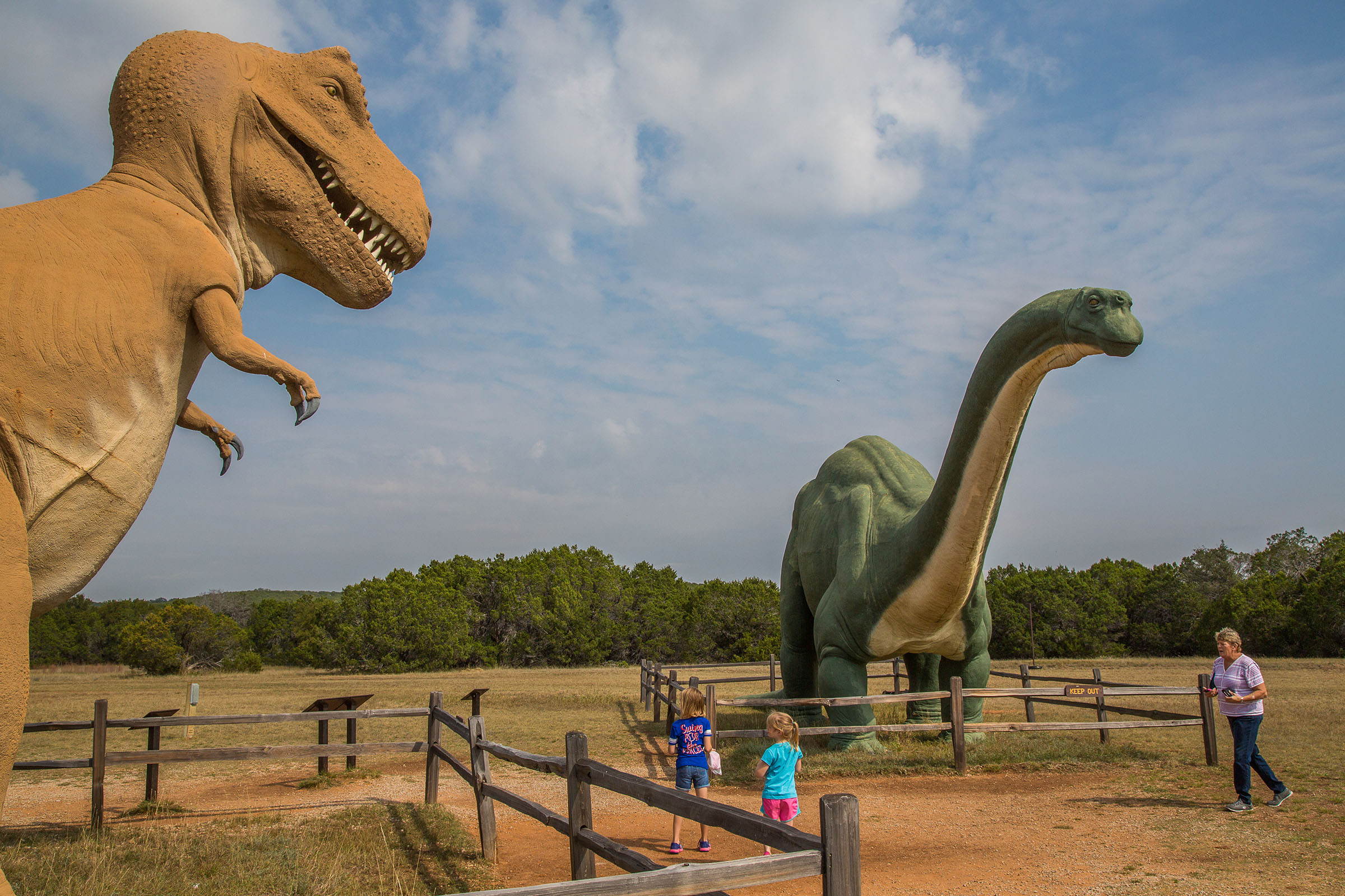 Dinosaur statues in a dusty environment