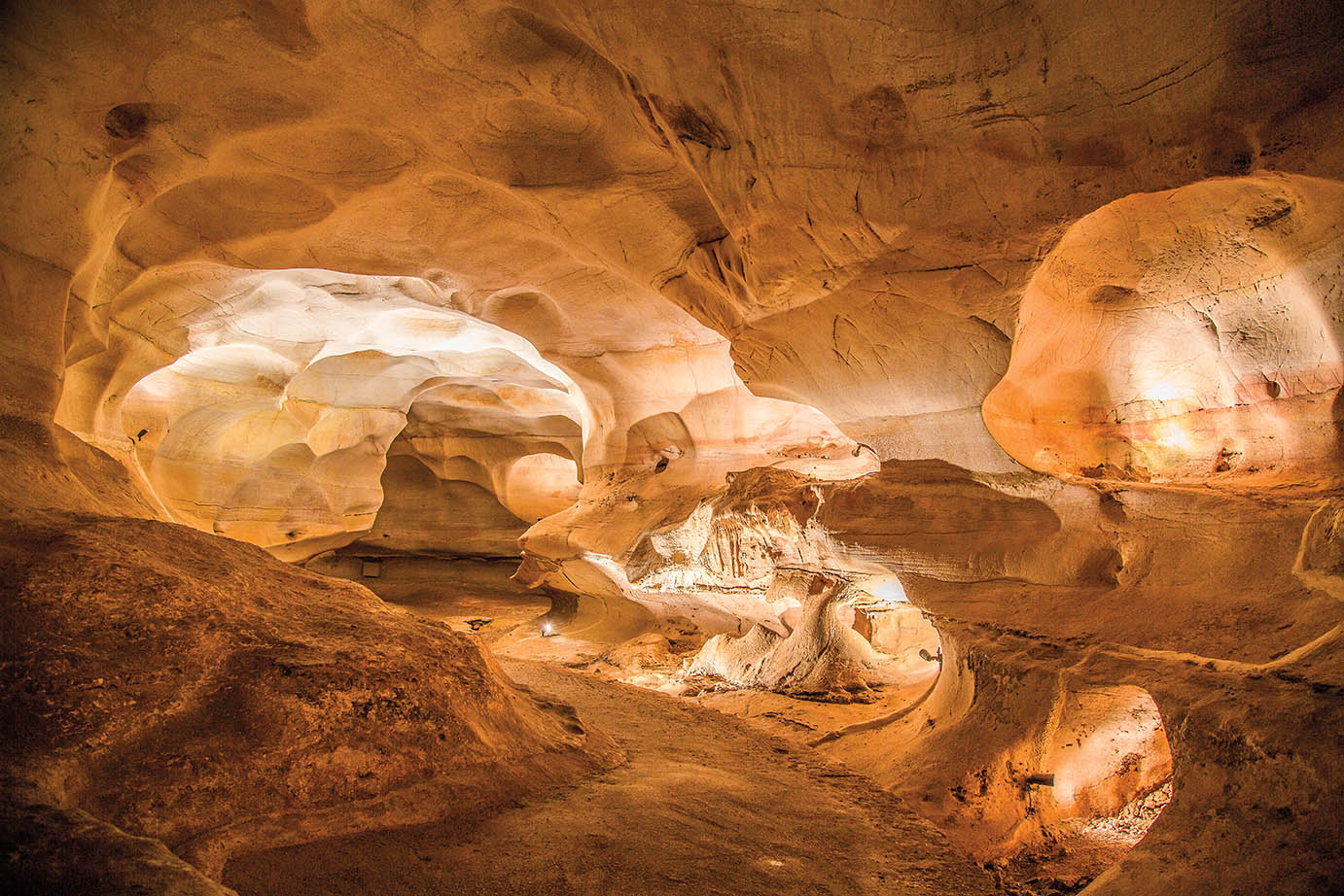 The lit interior of one of the rooms within Longhorn Cavern State Park.