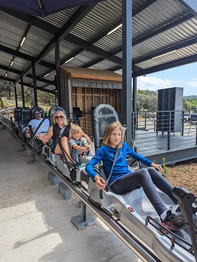 A rides the rollercoaster at Camp Fimfo.