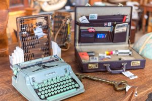 photo of hermes typewriter and briefcase on a desk