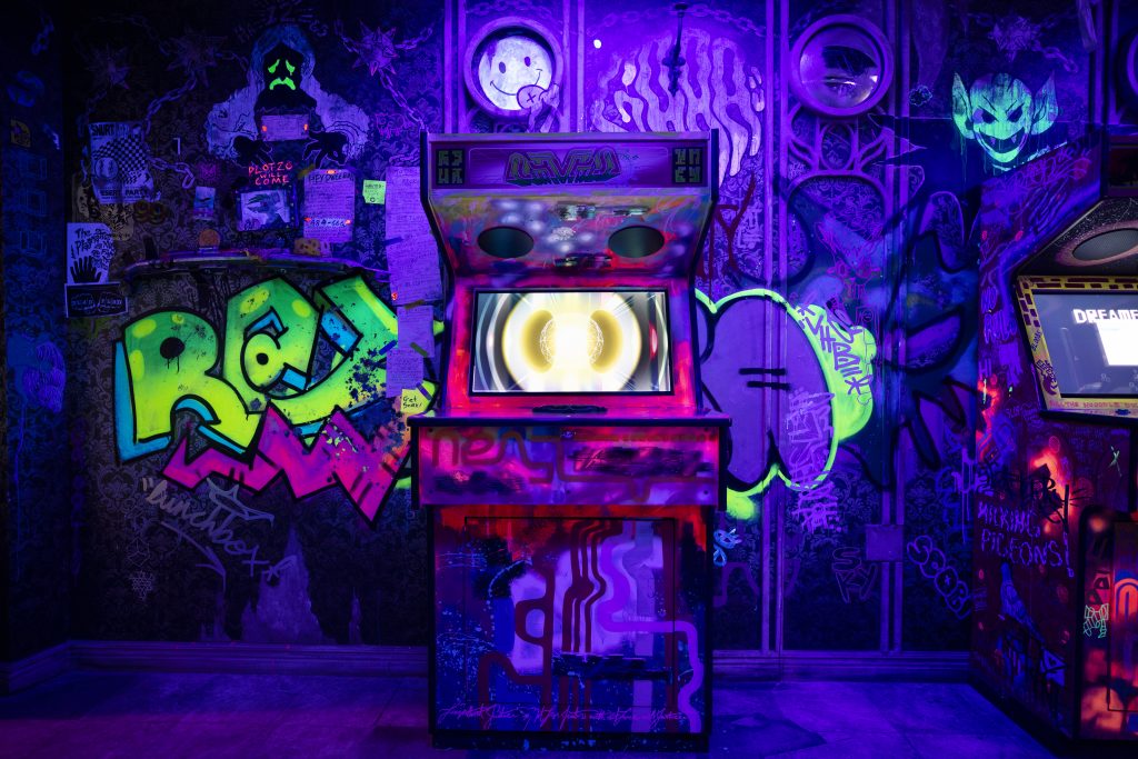 Wall Mural Arcade Machines - A Multi-Colored Gaming Room in Neon