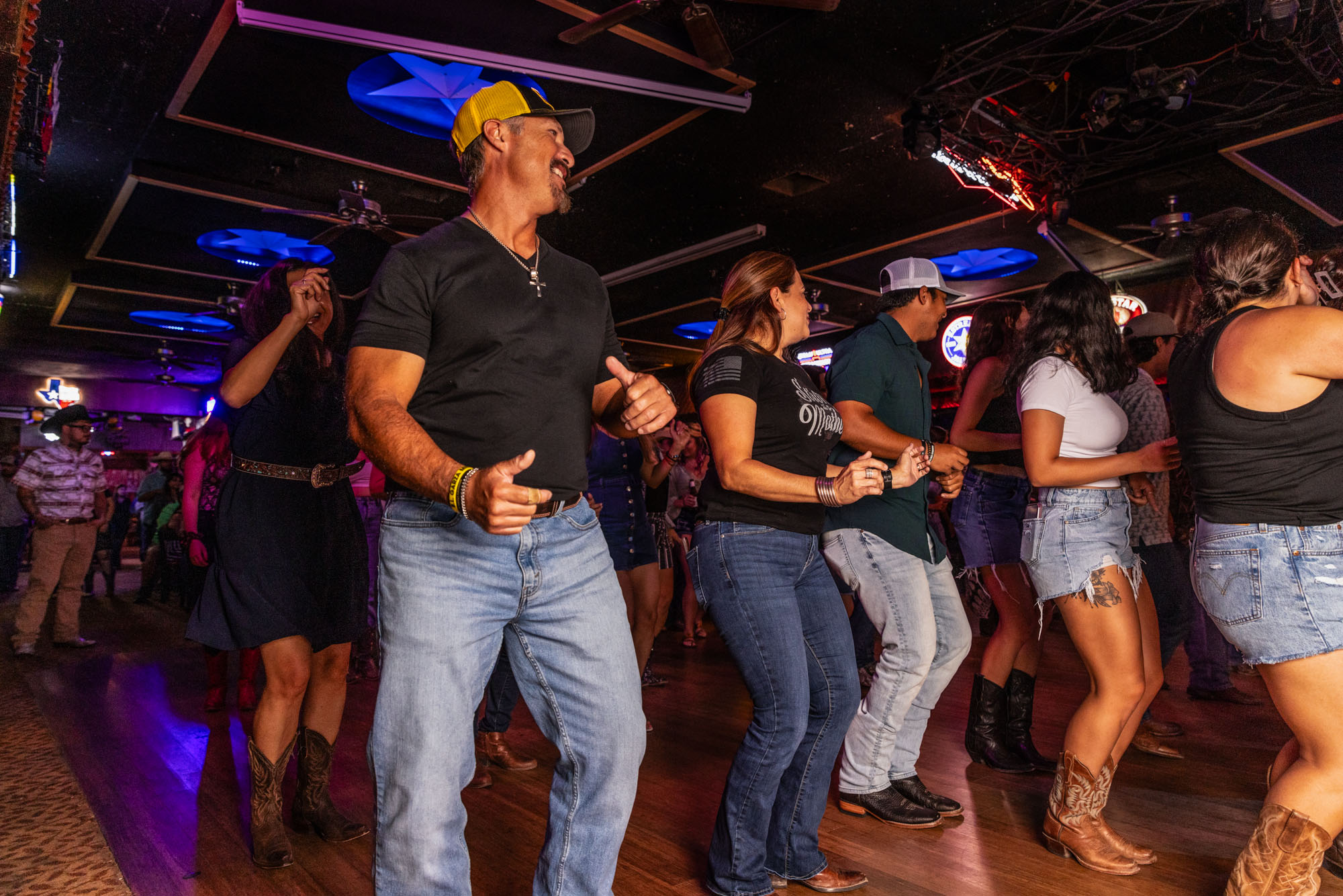 A group of people dancing in the venue.