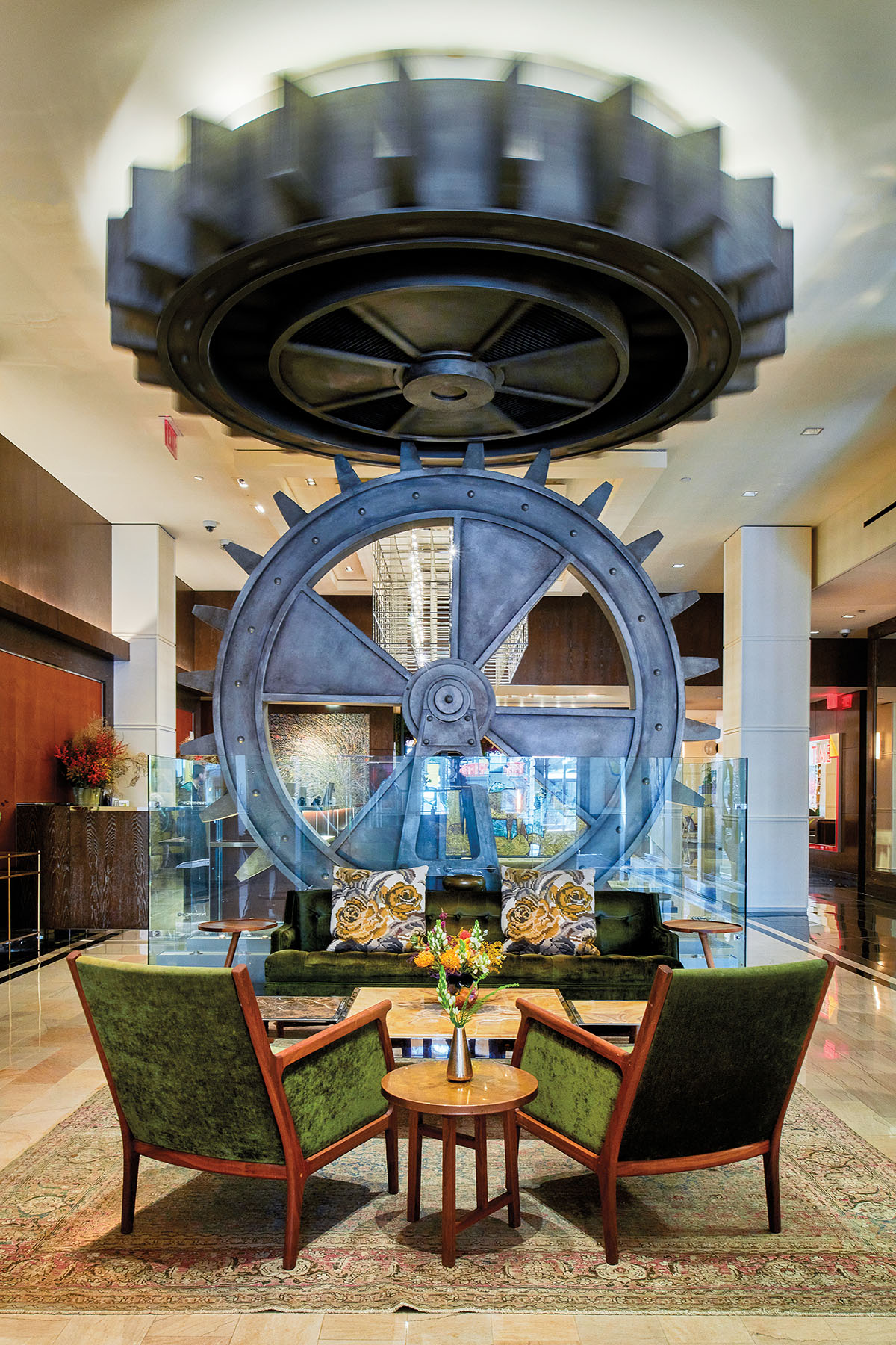 Large gears adorn a richly decorated hotel lobby