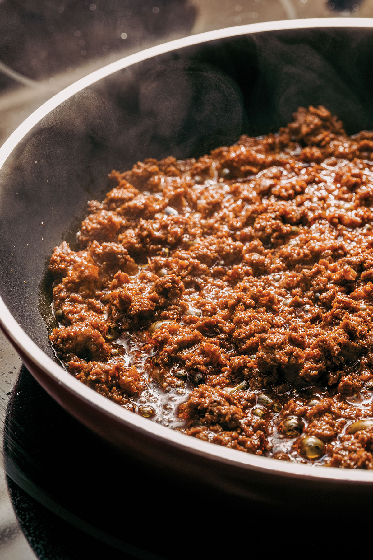 Golden brown chorizo cooking in a pan