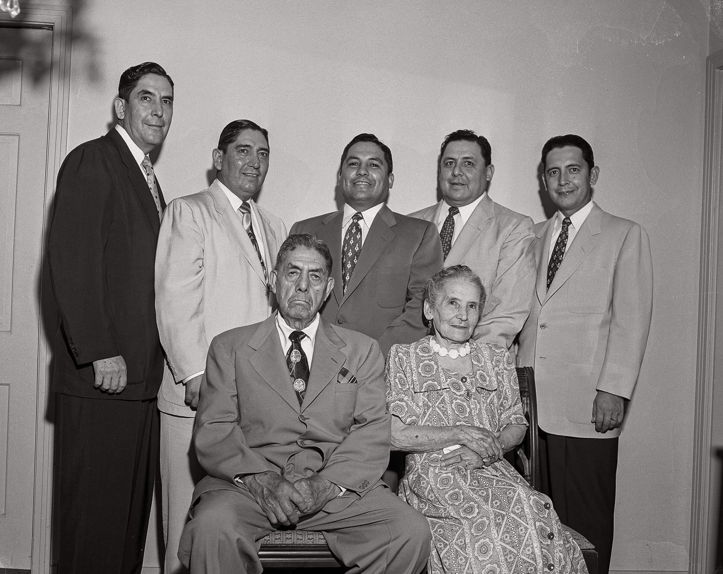 A black and white historic photo of a family