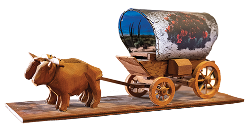 A small figurine of a wagon train