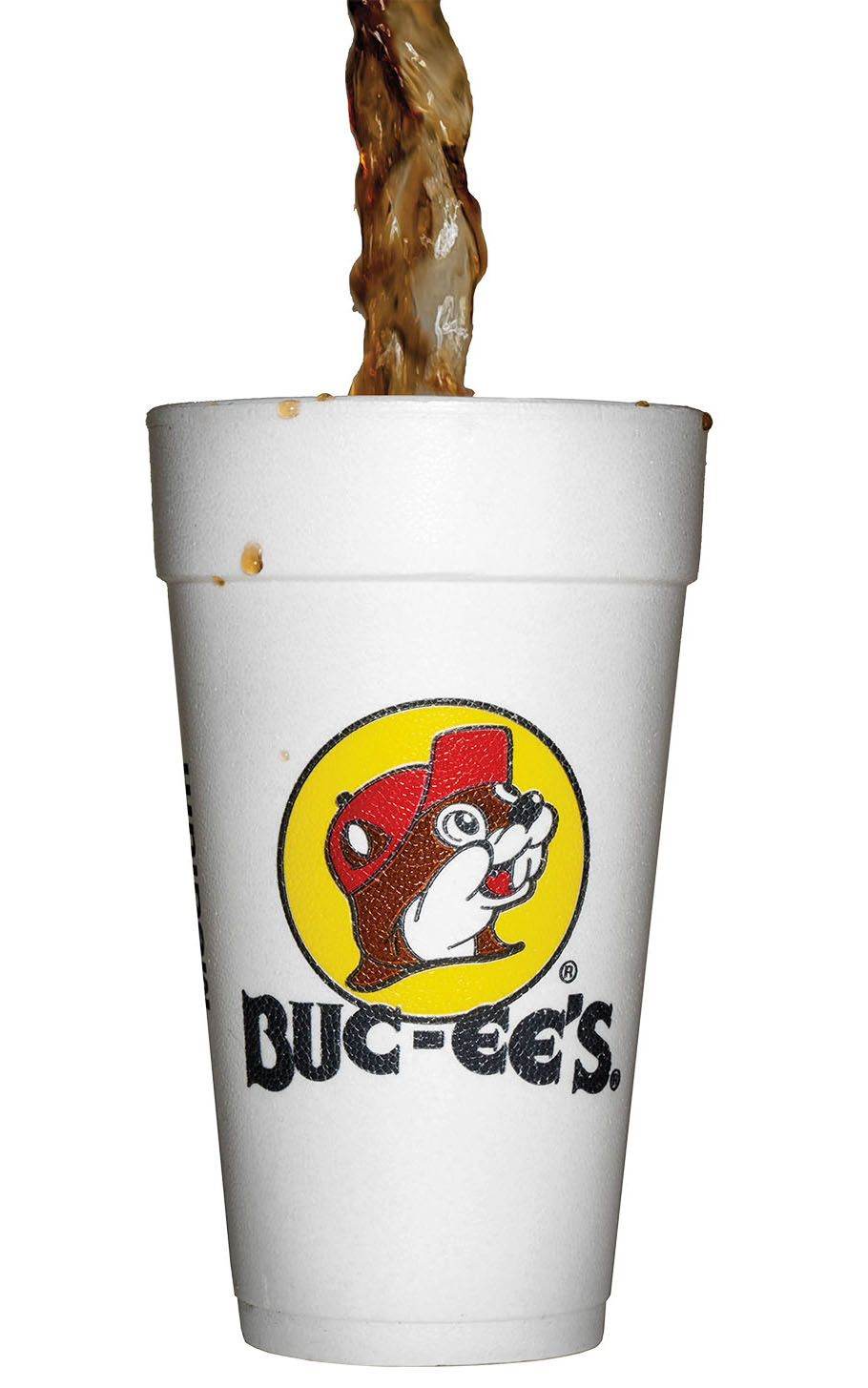A styrofoam Buc-ees cup being filled with dark cola