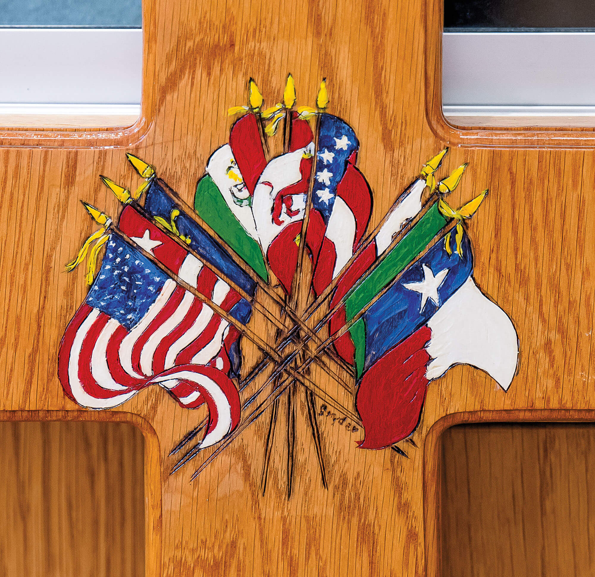 A painting of nine flags on a wooden door