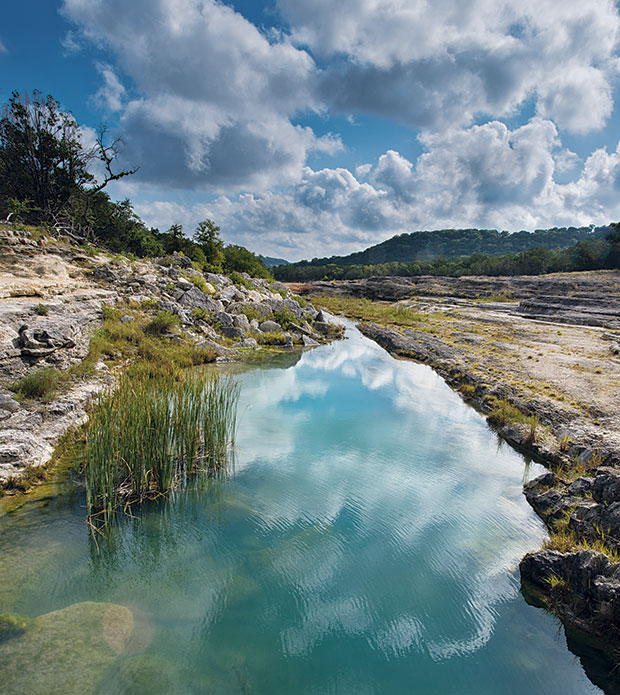 The floodwaters that topped the Canyon Lake spillway in 2002 carved a gorge more than a mile long.
