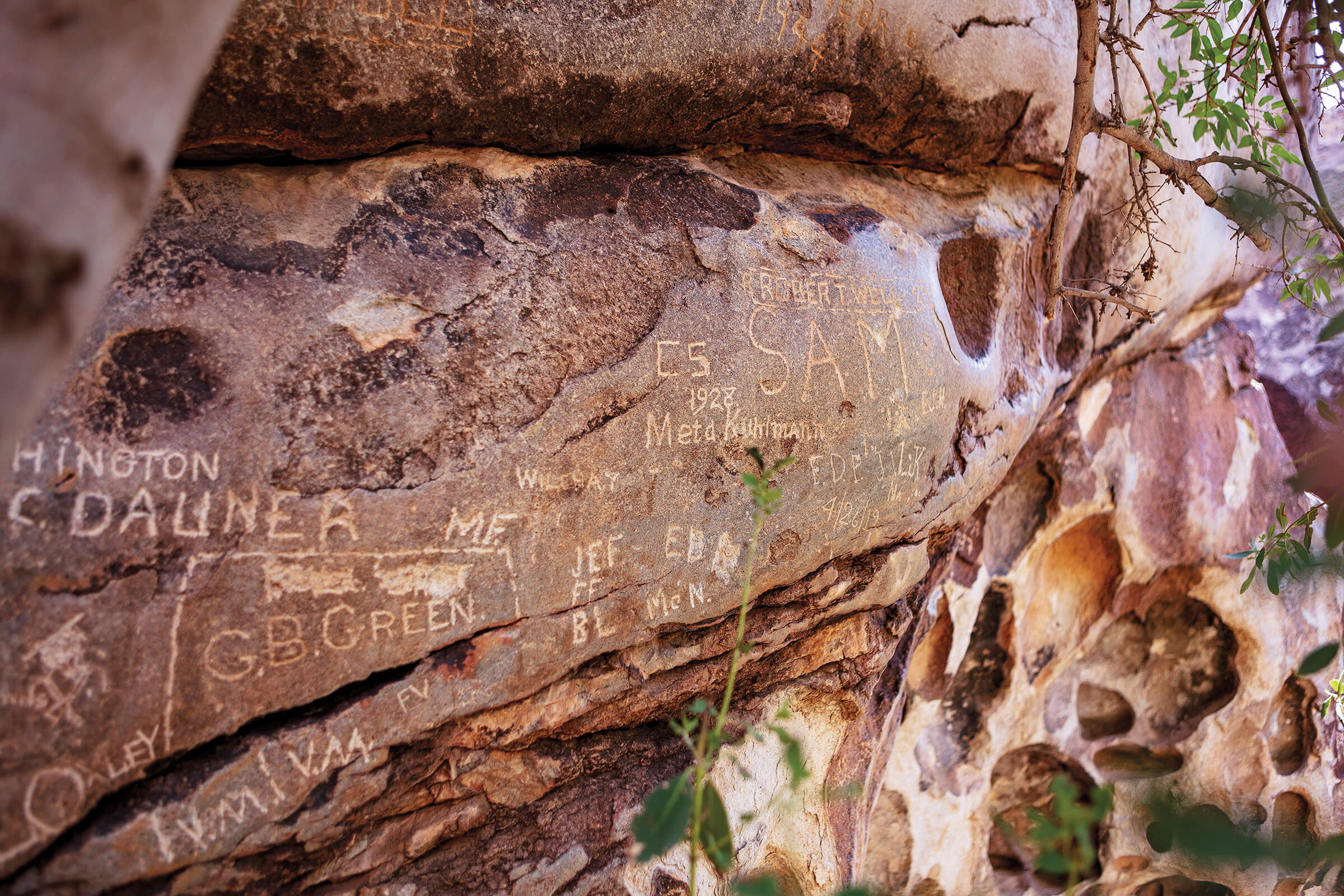 Words carved into reddish-gray rock