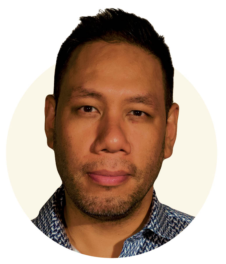 A portrait of a man wearing a collared shirt