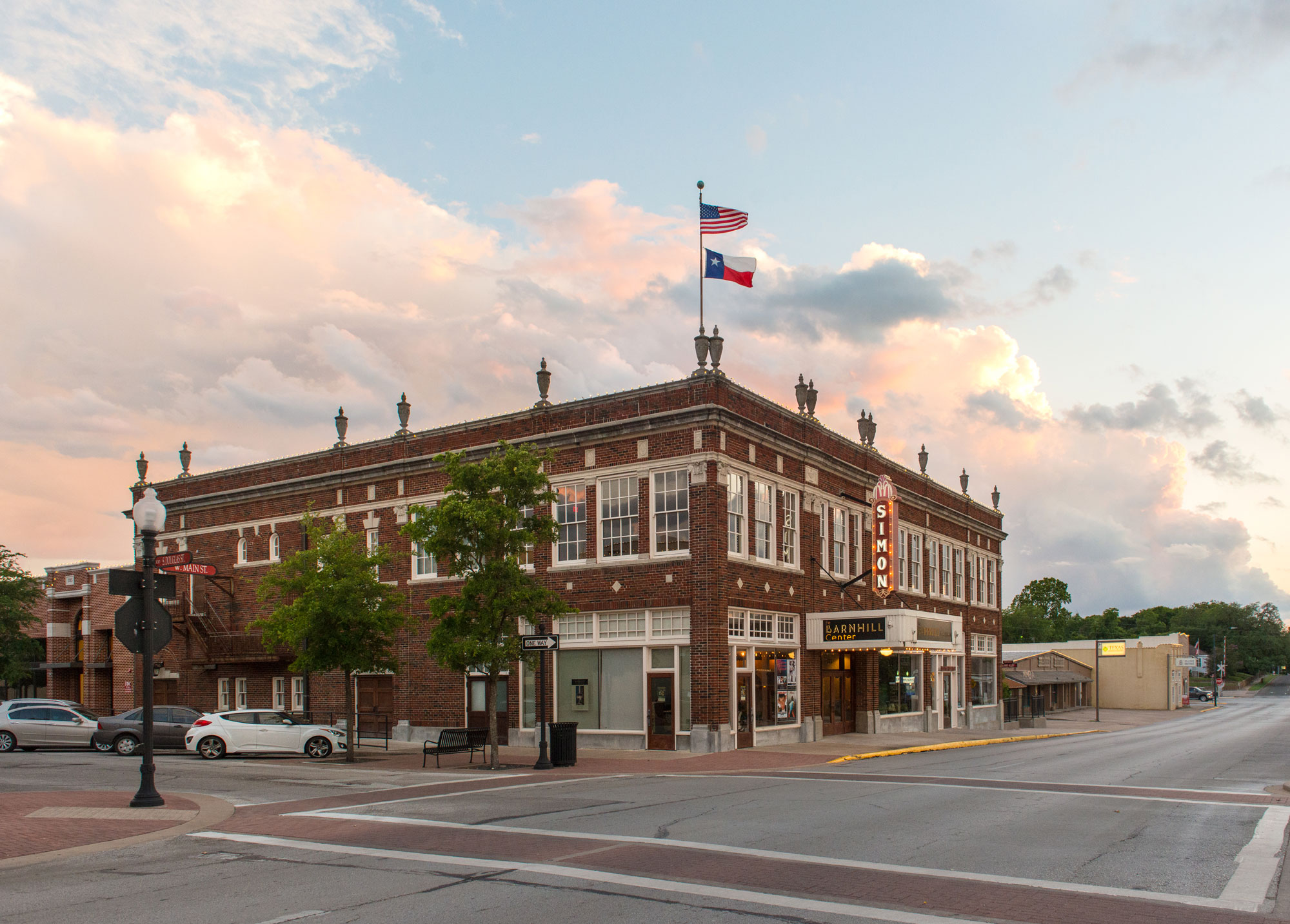 A theater called "Barnhill Center" in a historic building at sunset