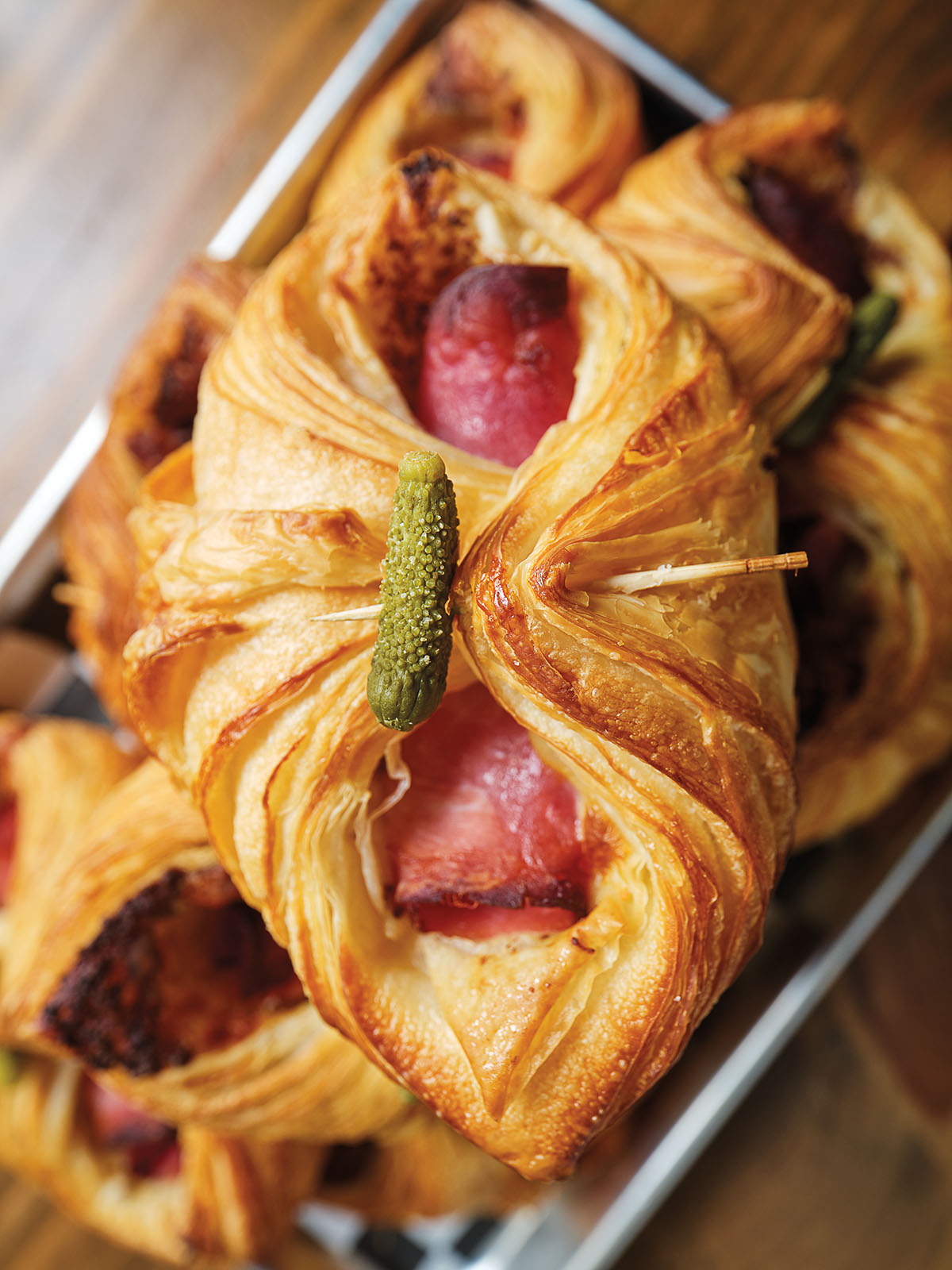 An overhead view of a golden pastry filled with meat