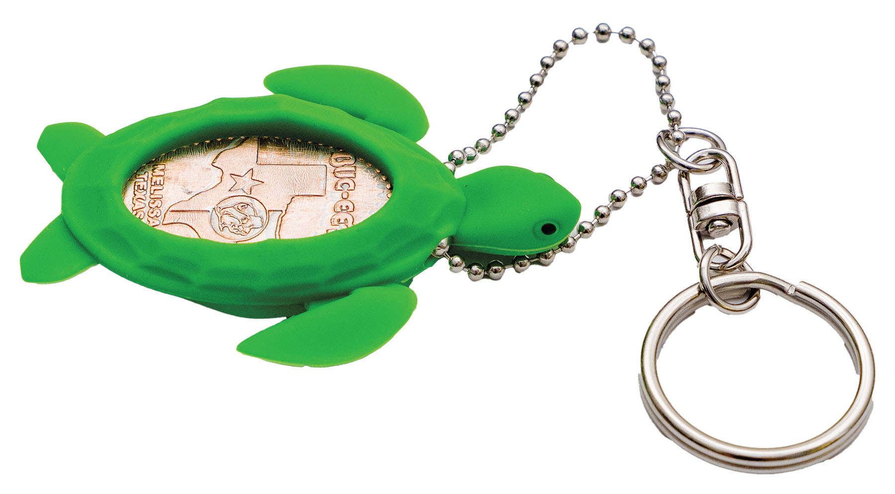 A pressed Buc-ee's penny inside of a green turtle-shaped holder