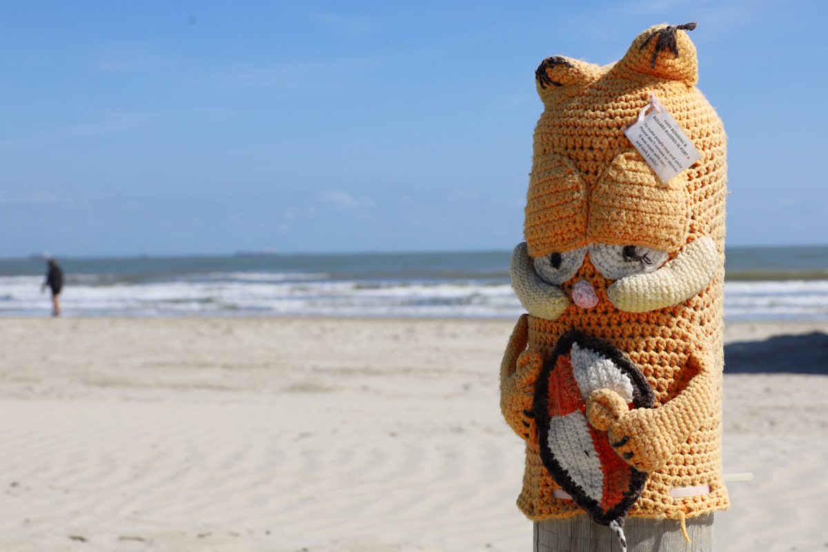 A crocheted Garfield covering on one of the bollards of Port Aransas' beach.