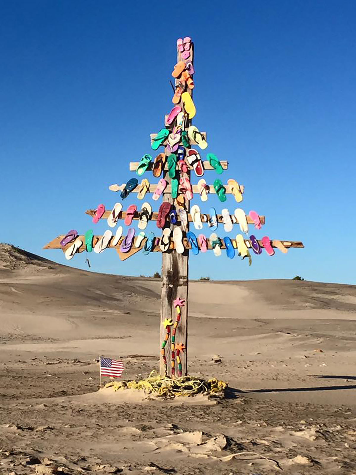 A "Christmas tree" made out of colorful sandals on South Padre Island's UFO Beach.