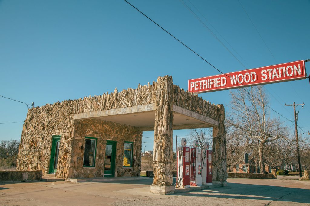 A gas station covered in petrified wood in Decatur, Texas