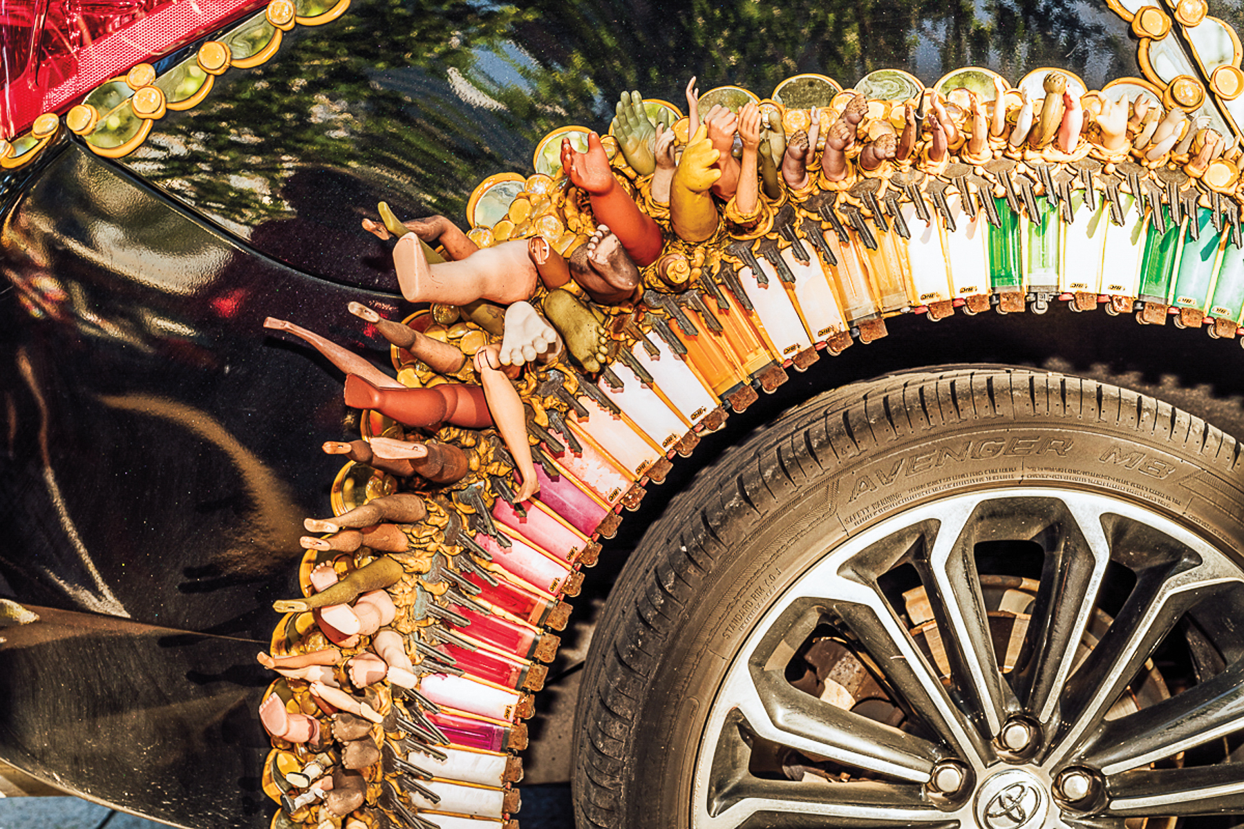 Several doll legs attached to a tire