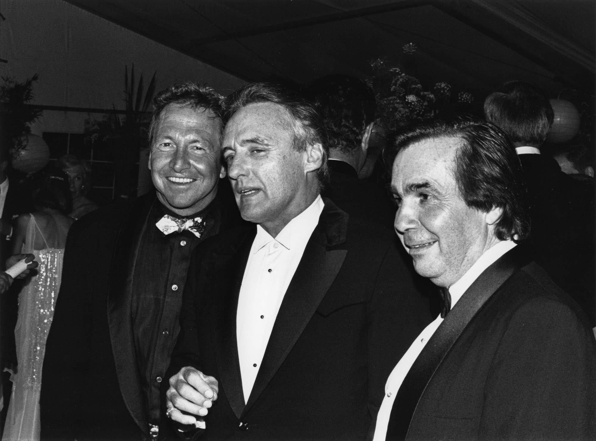 Three men in tuxedos in black-and-white