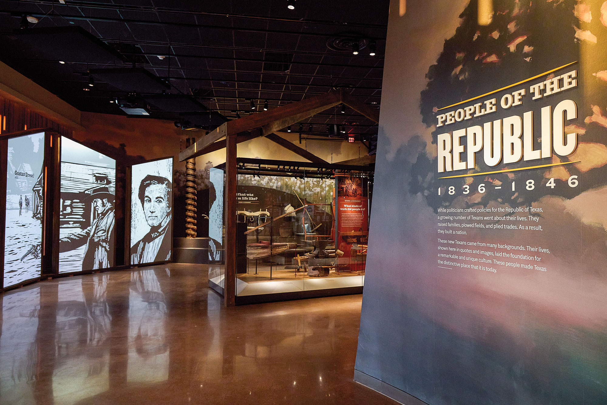 A museum exhibit with a sign that reads "People of the Republic" and artifacts in a glass case.