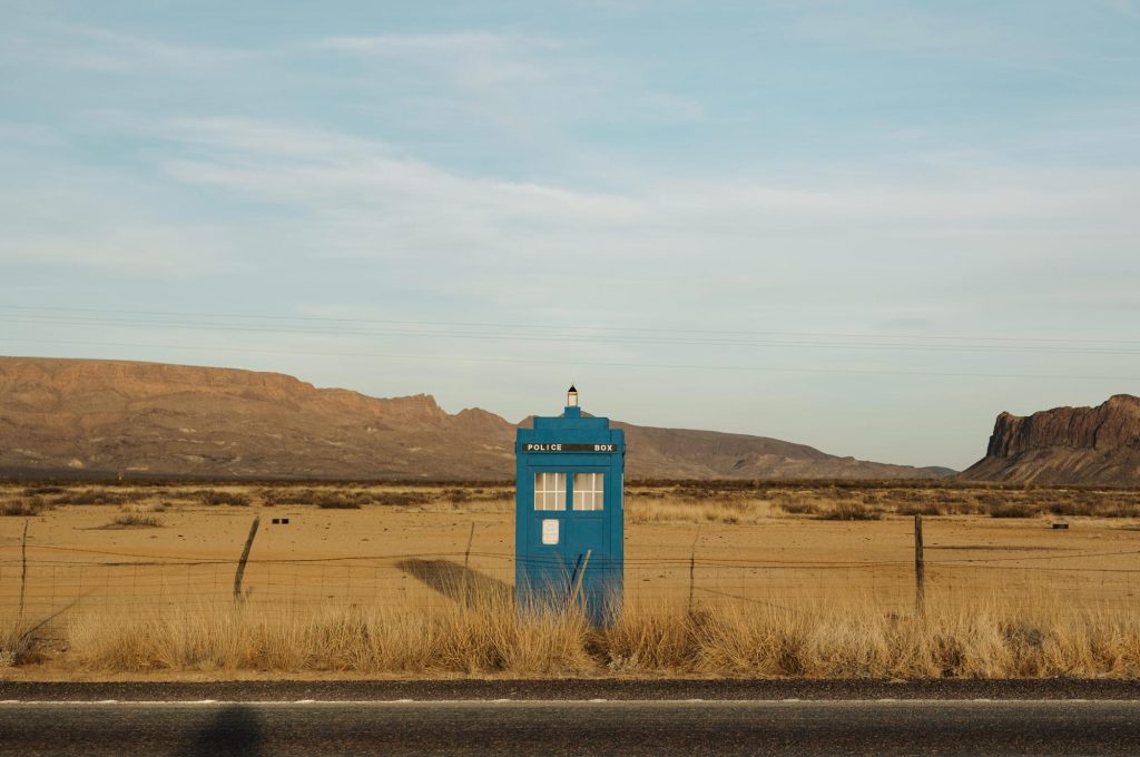 A blue telephone booth-looking TARDIS structure, with the words POLICE BOX visible near the top
