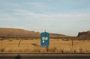 A blue telephone booth-looking TARDIS structure, with the words POLICE BOX visible near the top