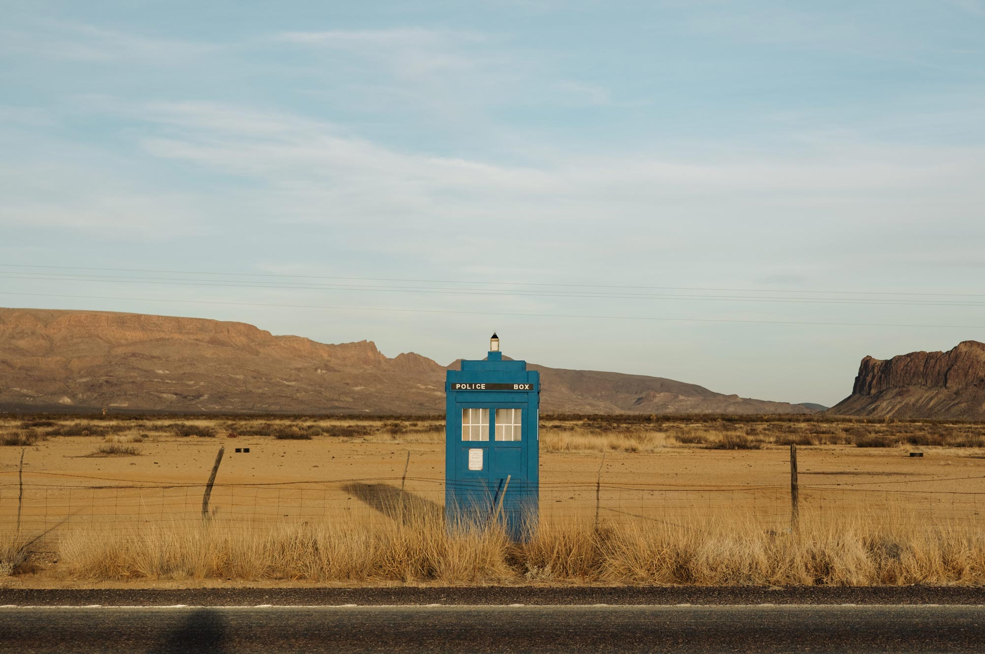 A blue telephone booth-looking TARDIS structure, with the words POLICE BOX visible near the top