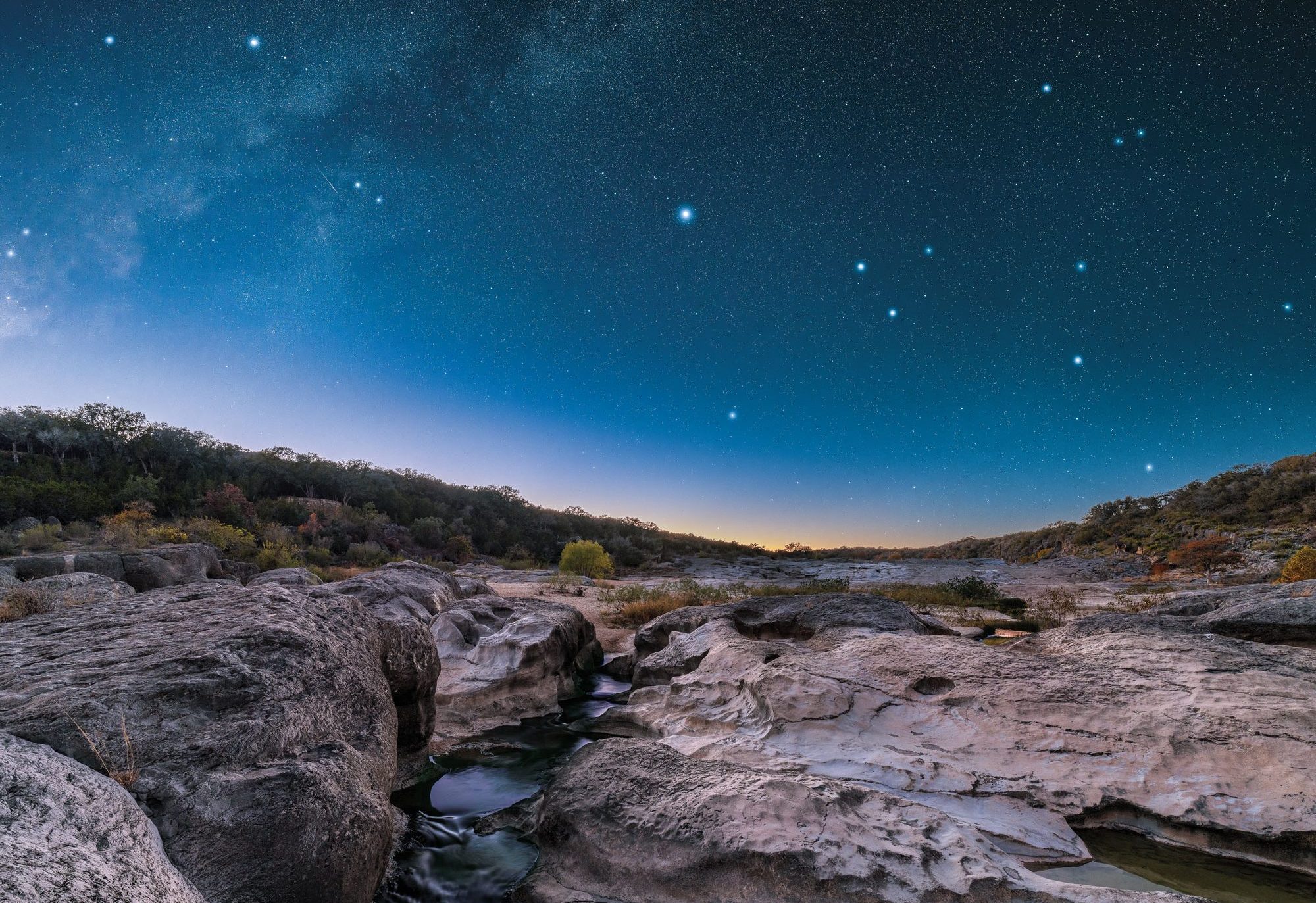 A starry night in a rocky canyon