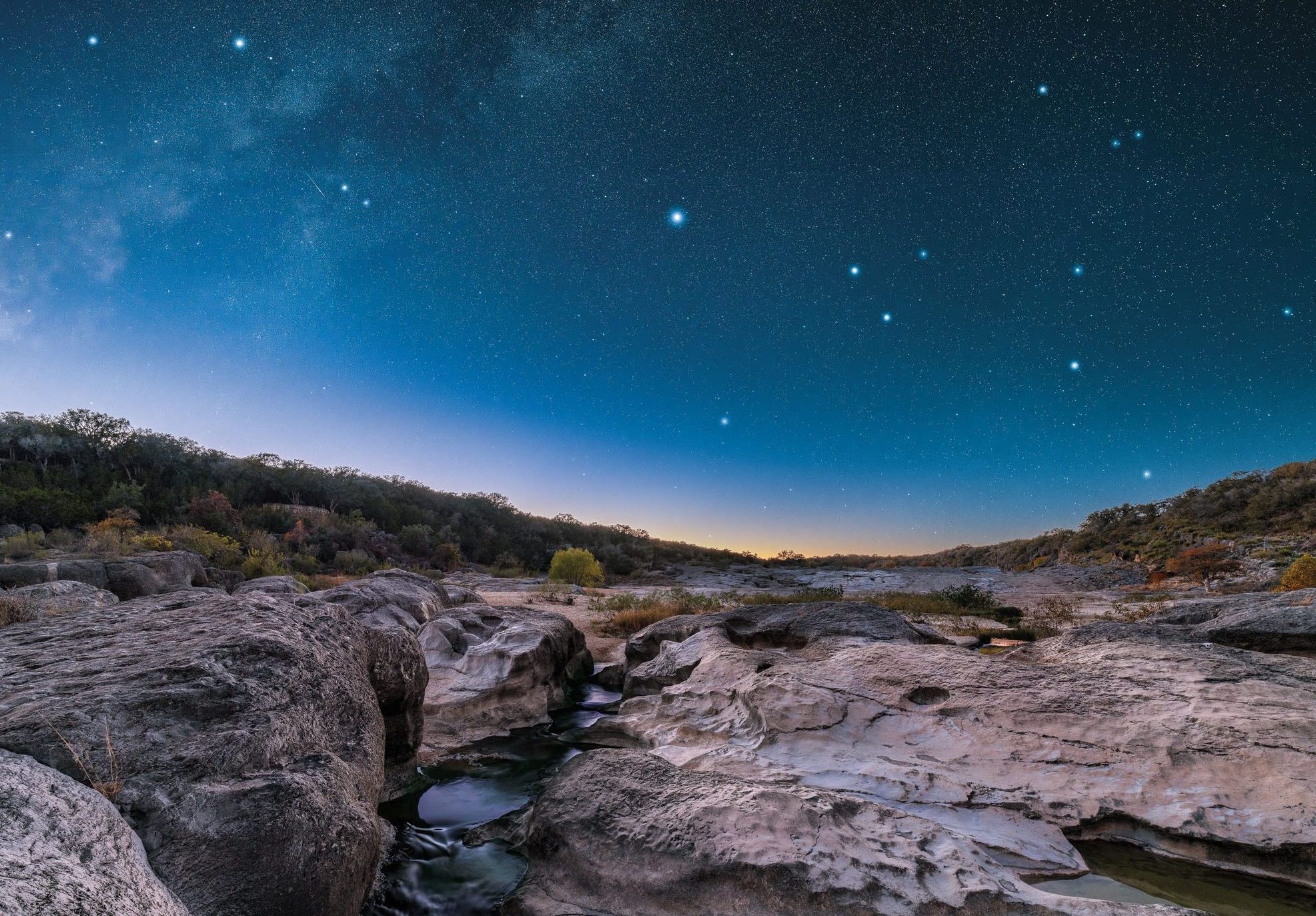 A starry night in a rocky canyon