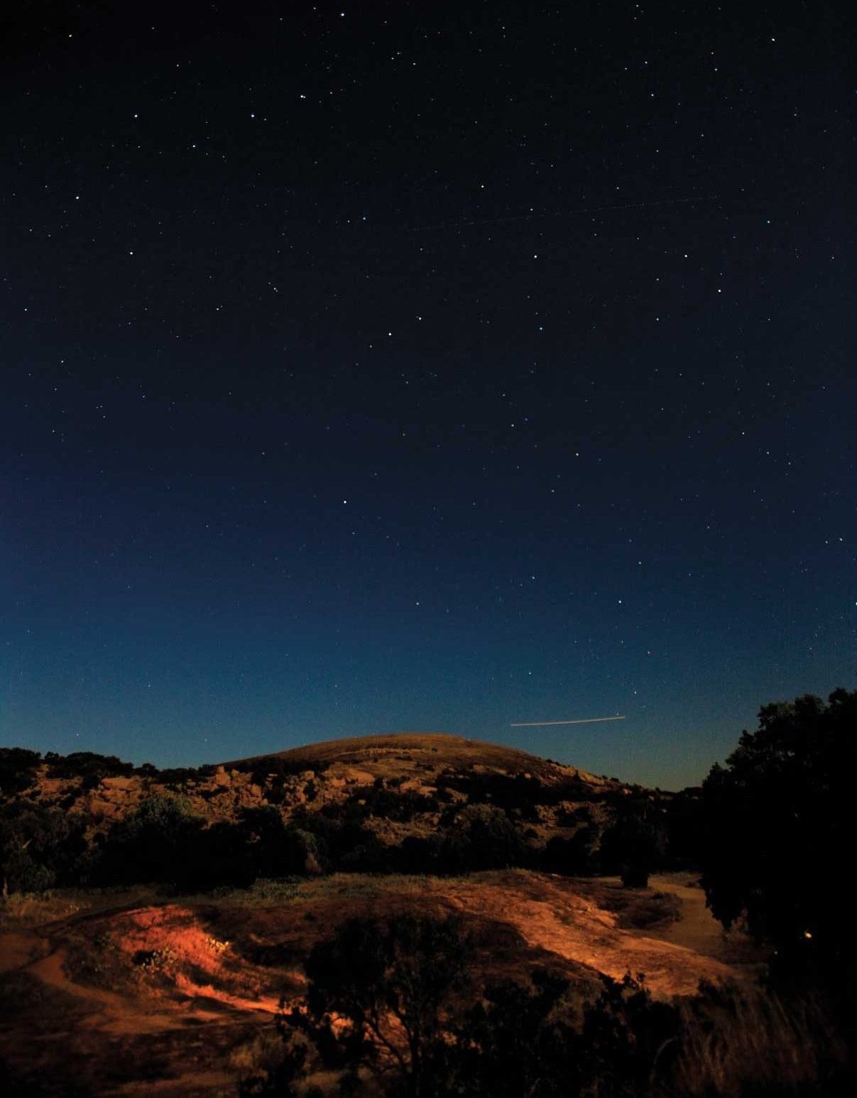 A rocky dome under a night sky