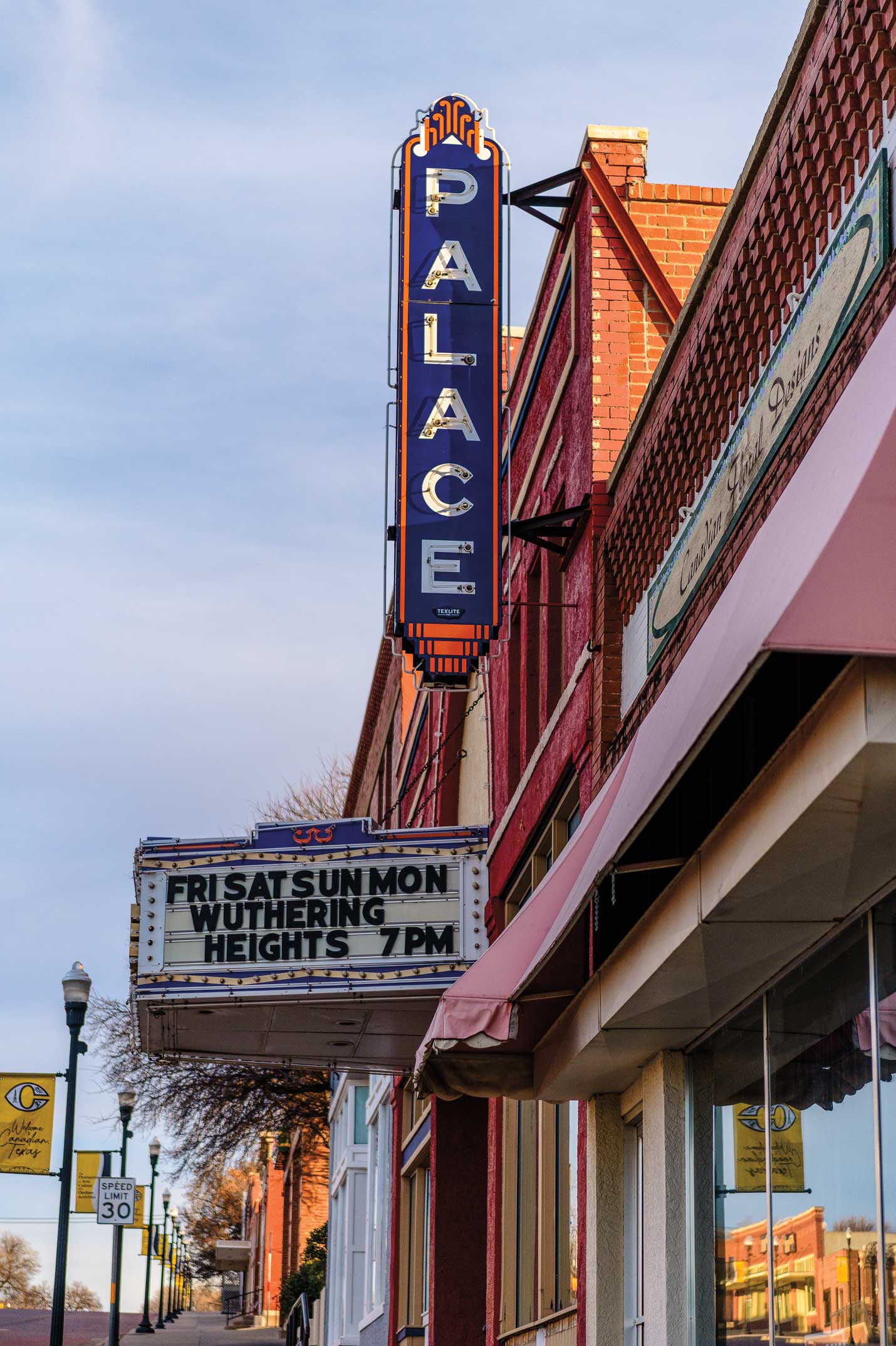 A theater sign that reads "Palace"