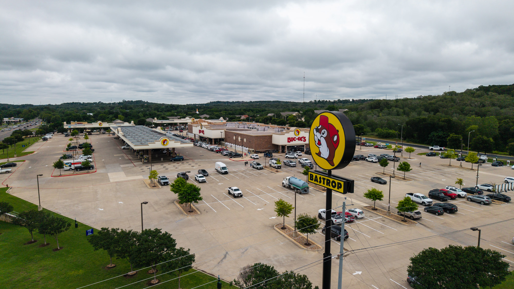 A large parking lot with a Buc-ee's sign and building